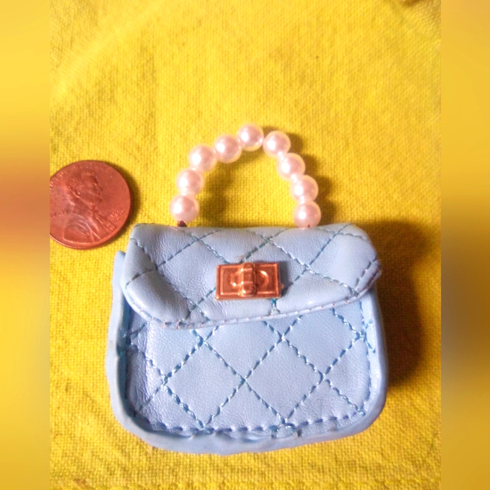 Zuru brand mini fashion purse with sword and faux perfume bottle